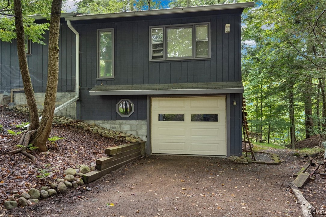 105 Riverside Drive Webb, NY 13420 - Photo 3 of 22 Extra attached and heated garage