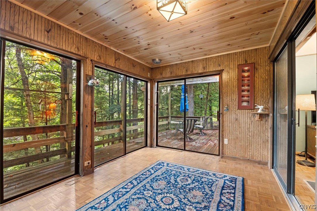 105 Riverside Drive Webb, NY 13420 - Photo 9 of 22 Beautiful glassed in sun room amongst the trees