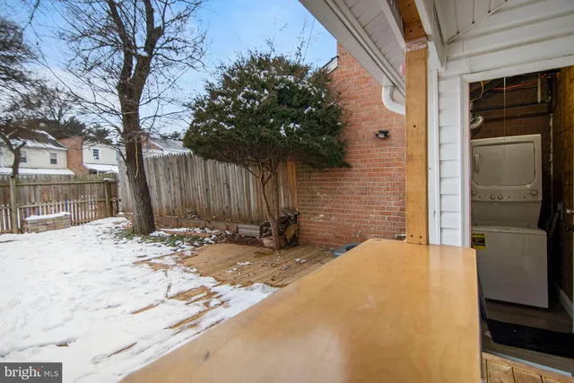 a backyard of a house with yard and outdoor seating
