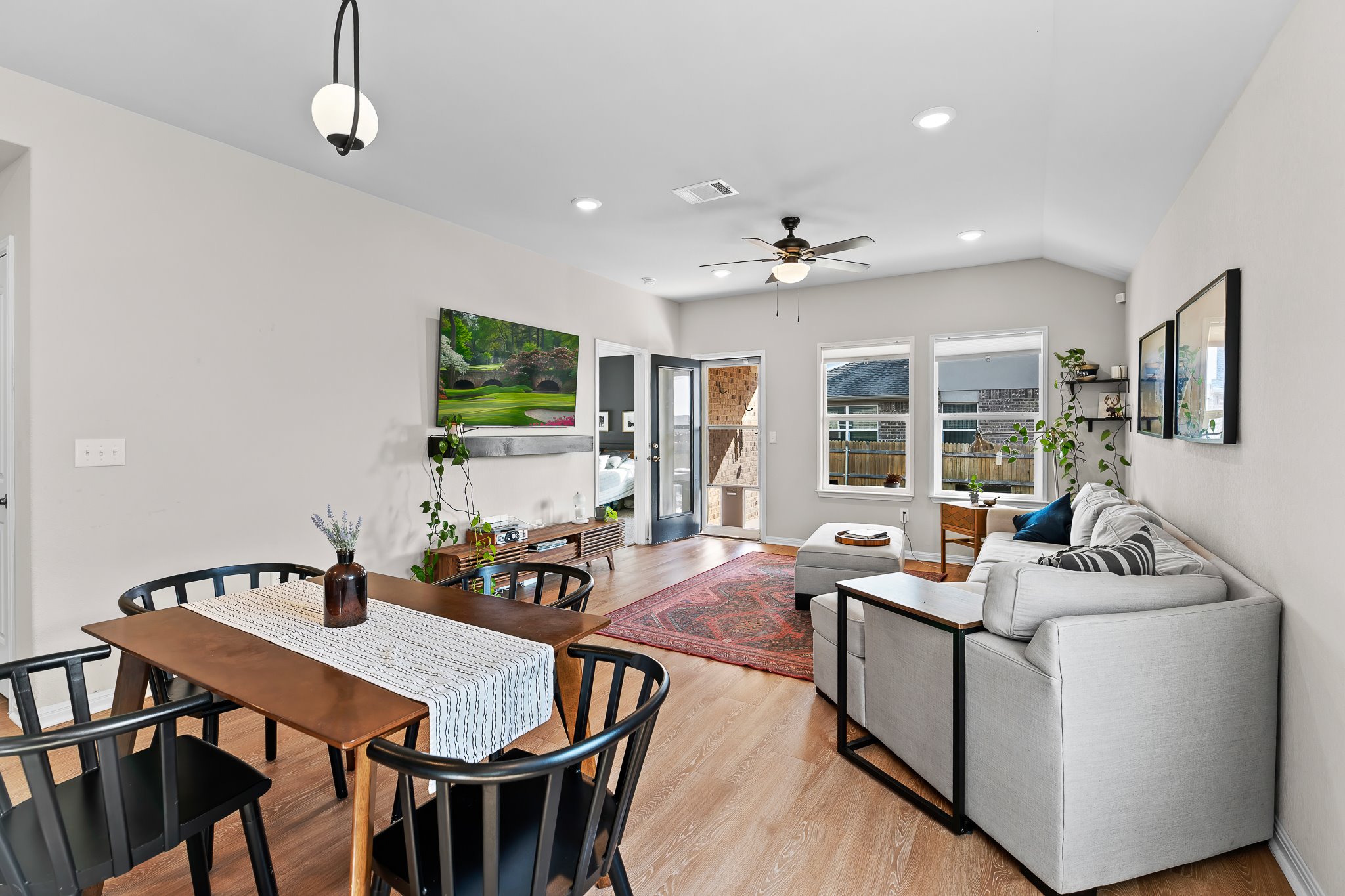 213 Mais Drive Georgetown, TX 78626 - Photo 14 of 39 a living room with furniture a flat screen tv and a dining table