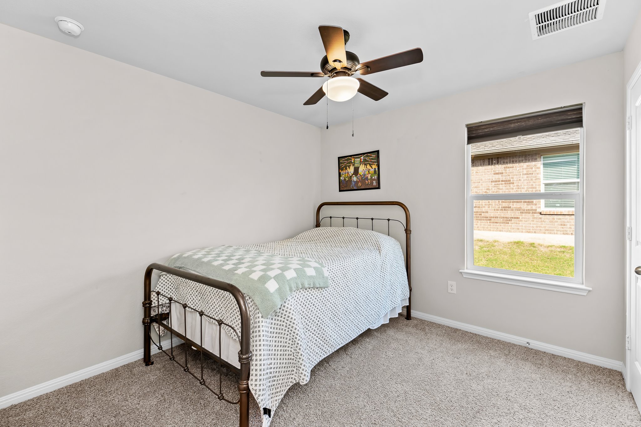213 Mais Drive Georgetown, TX 78626 - Photo 23 of 39 a bedroom with a bed and a window