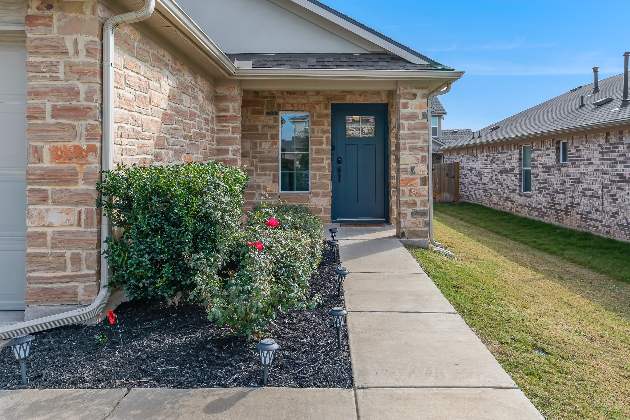 213 Mais Drive Georgetown, TX 78626 - Photo 4 of 39 a front view of a house with garden