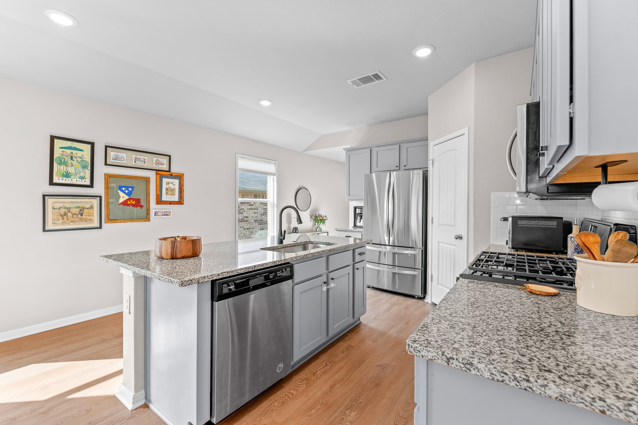 213 Mais Drive Georgetown, TX 78626 - Photo 10 of 39 a kitchen with stainless steel appliances granite countertop a sink stove and refrigerator