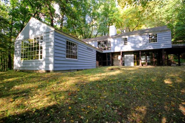 12 Norfield Road Weston, CT 06883 - Photo 1 of 1 a front view of a house with a garden