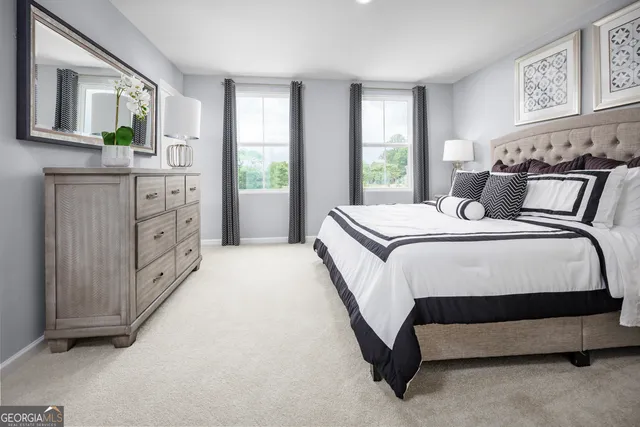 a bedroom with a bed and window