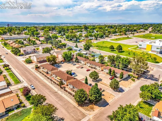 an aerial view of residential houses with outdoor space