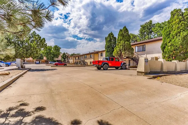 a view of street with parked cars