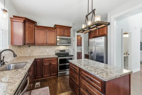 a view of dining room with furniture window and wooden floor