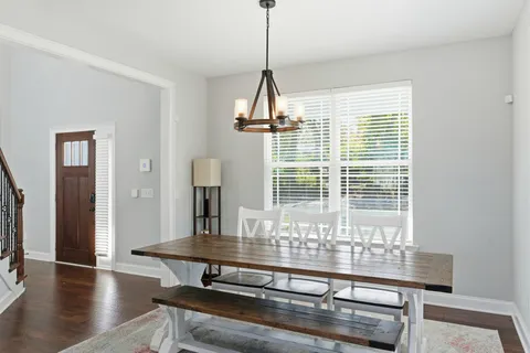 a bathroom with a sink mirror and toilet