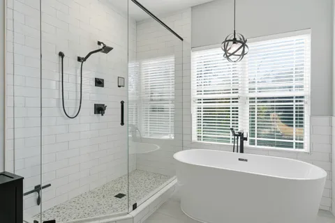 a workspace with wooden floor a chandelier fan and windows