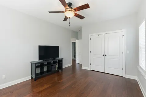 a hallway with granite countertop wooden cabinets a sink and dishwasher