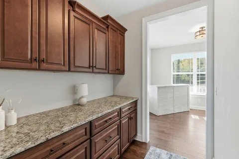 a view of a house with a fence
