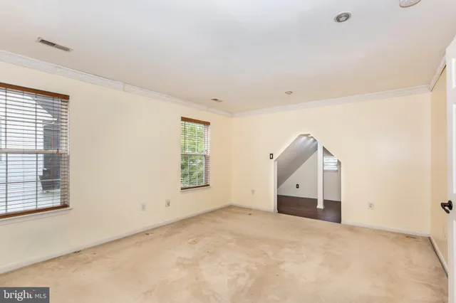 a view of empty room with windows