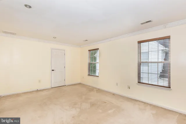 an empty room with windows