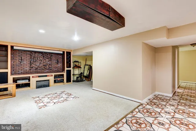 a view of a bedroom with furniture and window