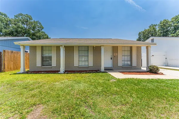 front view of a house with a yard