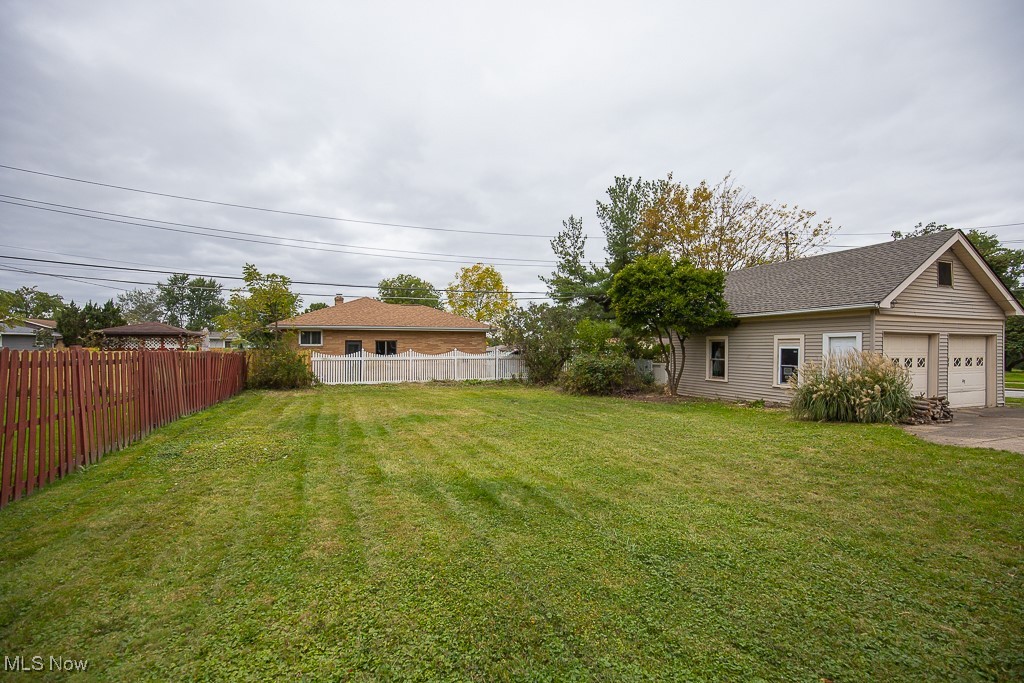 7070 Ridge Road Parma, OH 44129 - Photo 27 of 28 View of yard featuring a garage