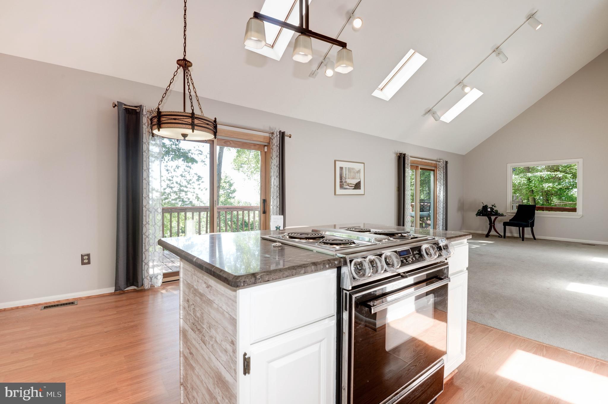 1619 Summit Drive Haymarket, VA 20169 - Photo 8 of 62 a kitchen with granite countertop a stove sink and chandelier