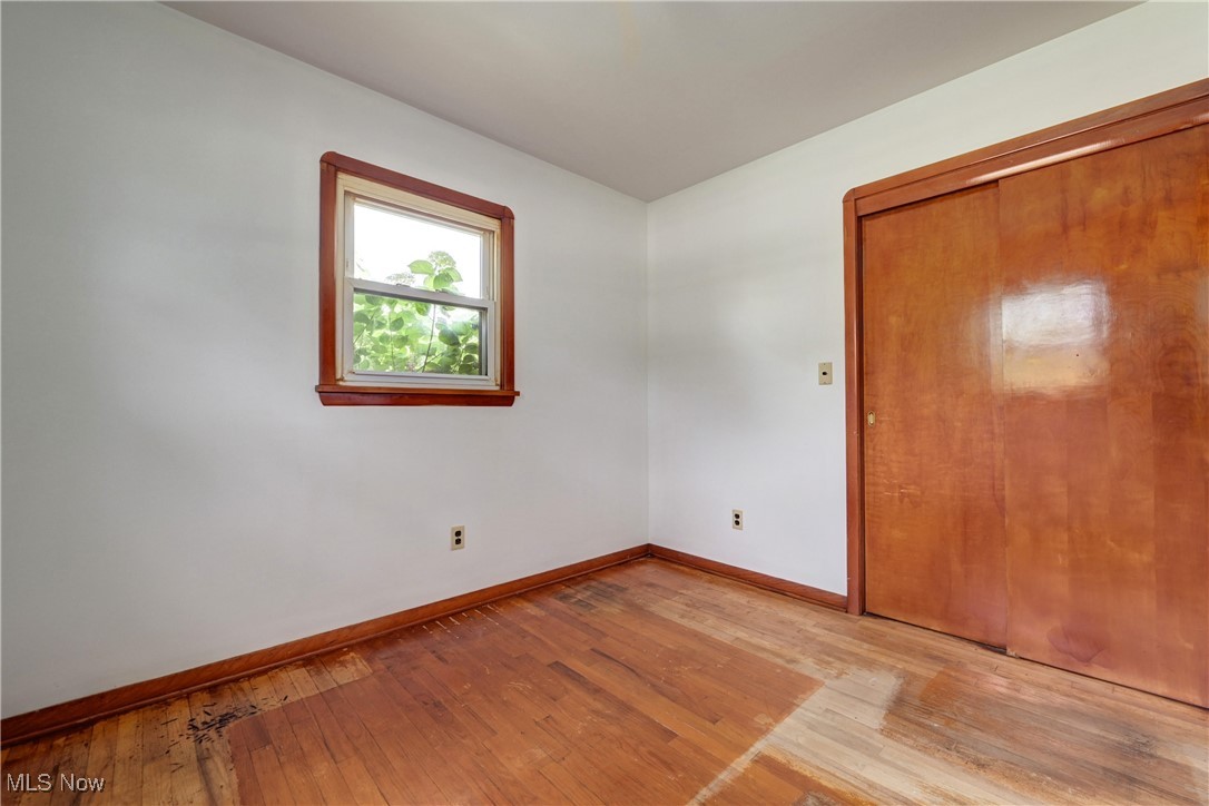 1140 West River Road Vermilion, OH 44089 - Photo 18 of 49 Empty room with light wood-type flooring and baseboards