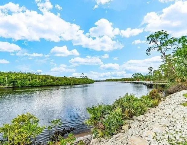 an aerial view of a tennis ground with a street