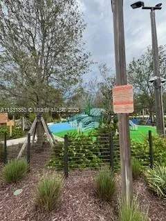 a view of a swimming pool with a yard