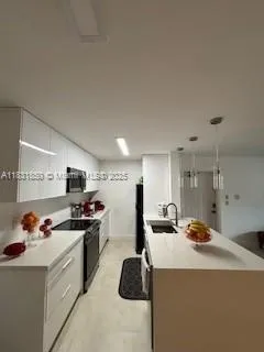 a view of a room with gym equipment and a floor to ceiling window