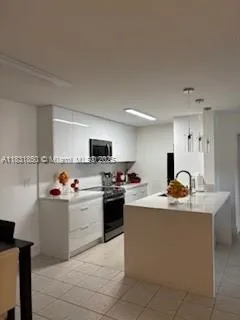 a bathroom with a sink mirror toilet and bathtub