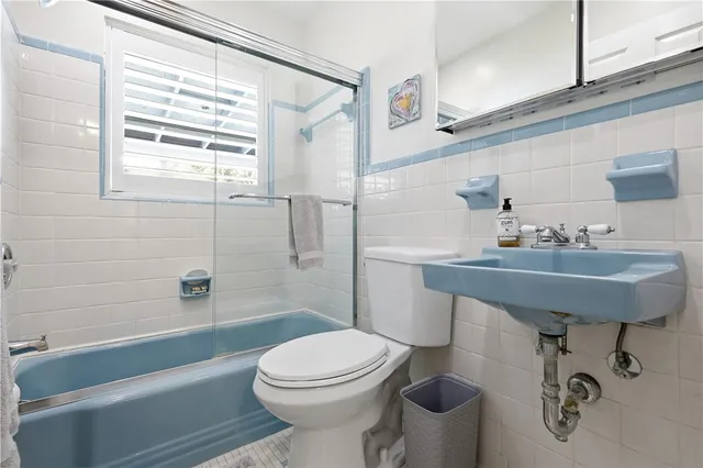 a swimming pool with outdoor seating and yard