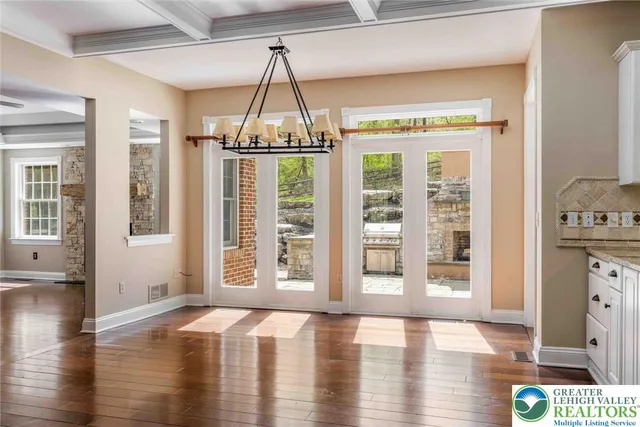 a view of a glass door with a bench