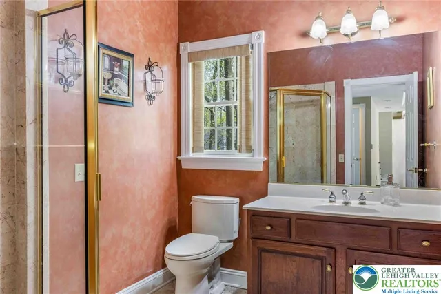 a view of kitchen with stainless steel appliances cabinets and a window