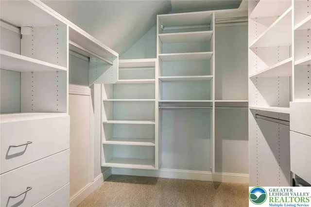 a bathroom with a sink toilet and window