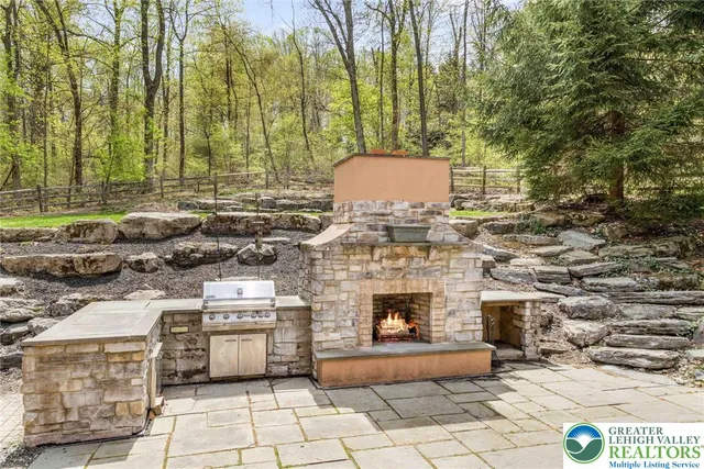 a view of a backyard with sitting area