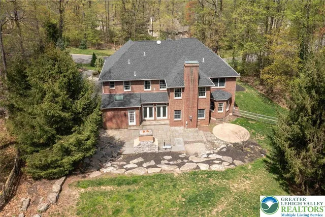 an aerial view of residential house with outdoor space
