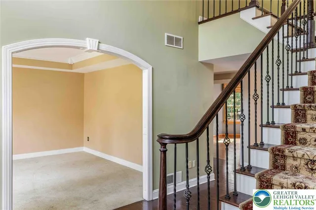 a view of livingroom with furniture wooden floor and windows