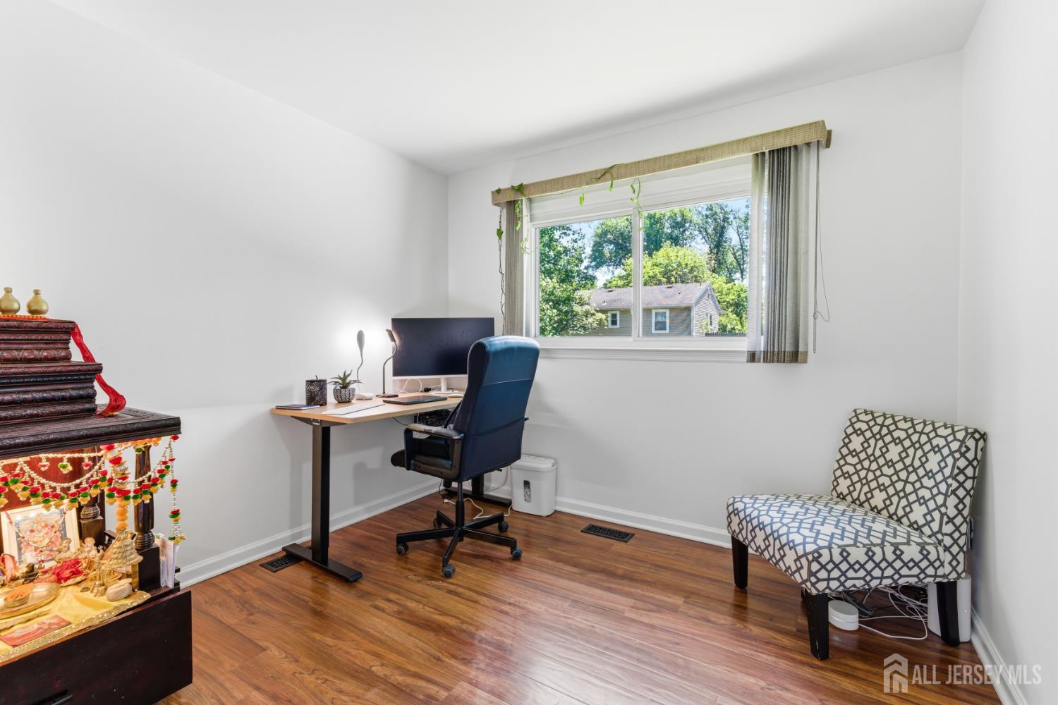 213 Normandy Road Edison, NJ 08820 - Photo 21 of 45 a workspace with furniture and a window
