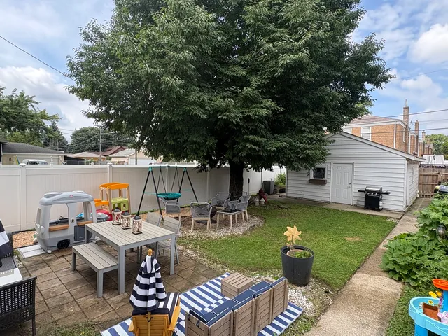 an outdoor space with furniture and garden