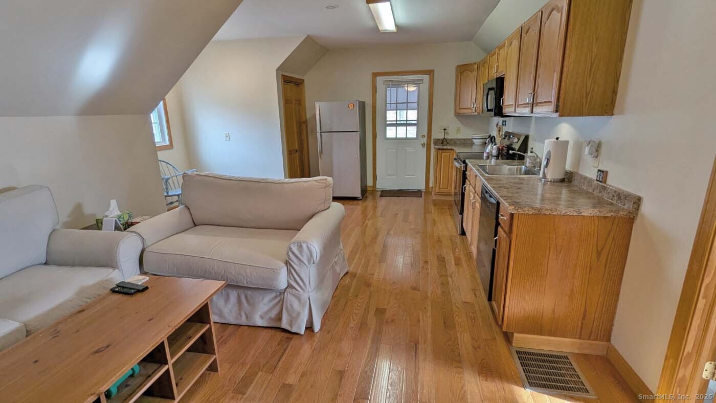 34 Hog Hill Road East Hampton, CT 06424 - Photo 2 of 11 a living room with furniture and a table