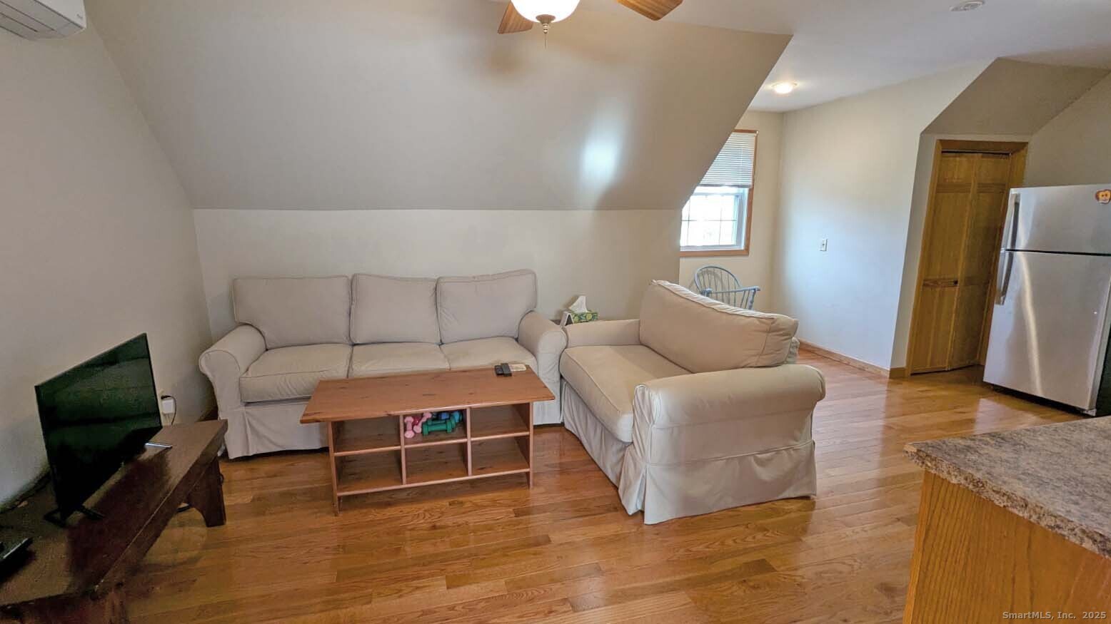 34 Hog Hill Road East Hampton, CT 06424 - Photo 4 of 11 a living room with furniture and a flat screen tv