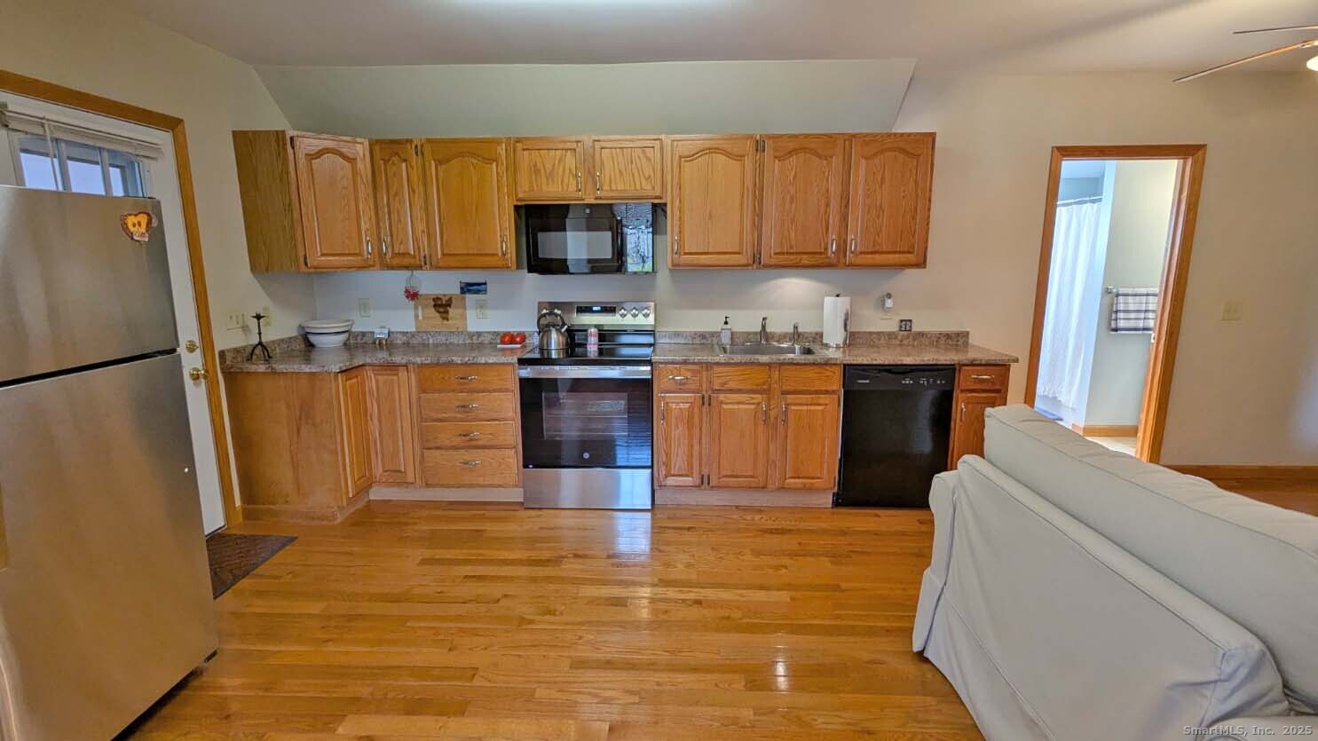 34 Hog Hill Road East Hampton, CT 06424 - Photo 5 of 11 a kitchen with granite countertop a refrigerator stove top oven and sink