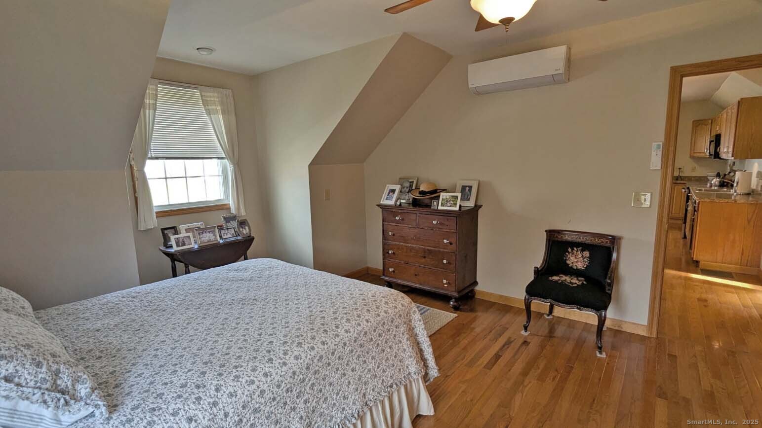 34 Hog Hill Road East Hampton, CT 06424 - Photo 8 of 11 a bedroom with a bed and wooden floor