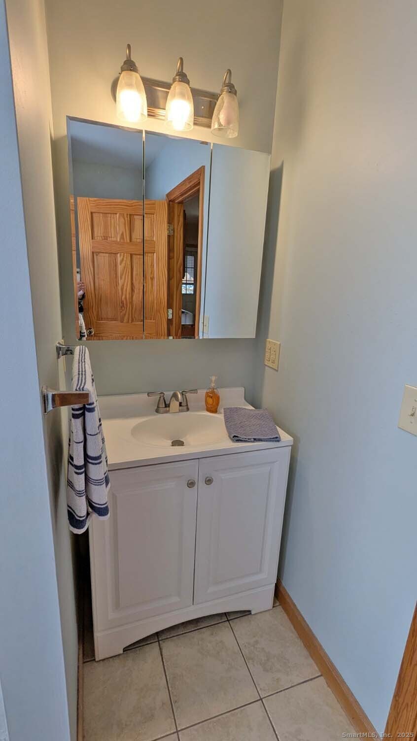 34 Hog Hill Road East Hampton, CT 06424 - Photo 10 of 11 a bathroom with a sink and mirror