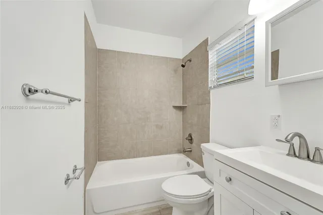 a bathroom with a sink toilet and vanity