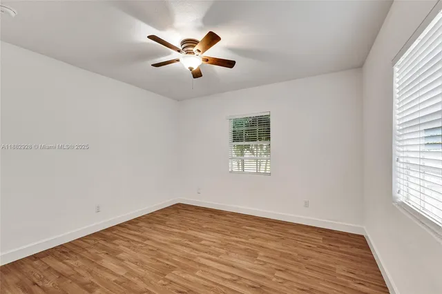 a view of a pathway both side of a yard