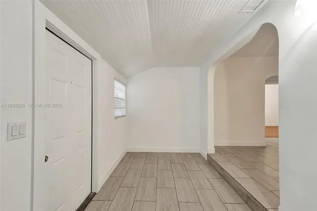 a view of a chandelier fan in a room