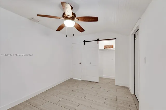 a house with trees in the background