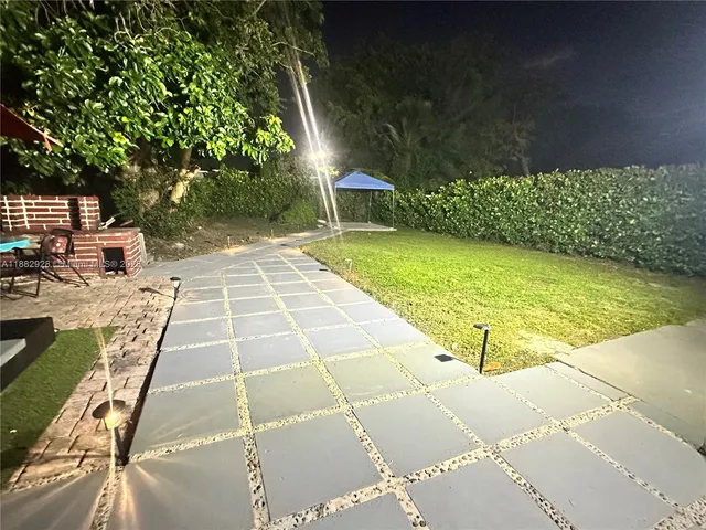 a view of backyard with seating space