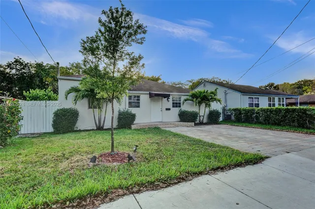 a house view with a garden space