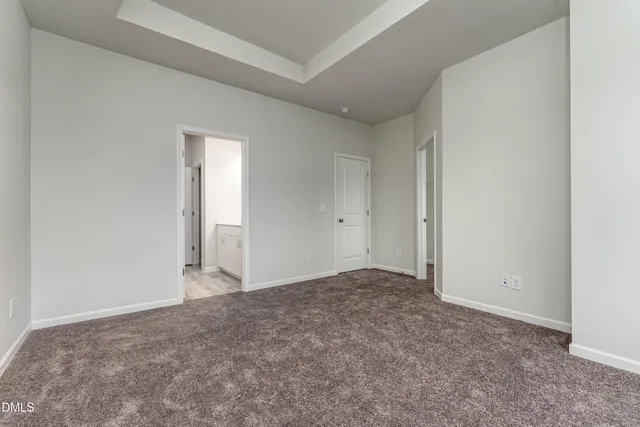 a view of an empty room and entryway