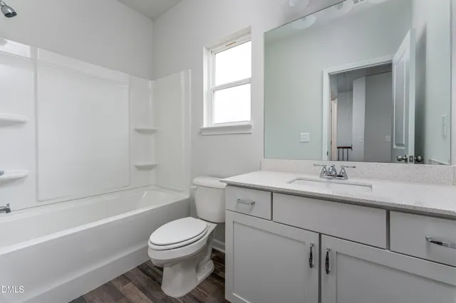 a bathroom with a sink a toilet and a bathtub