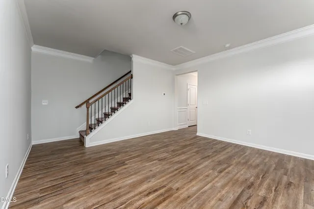 a view of an entryway with wooden floor